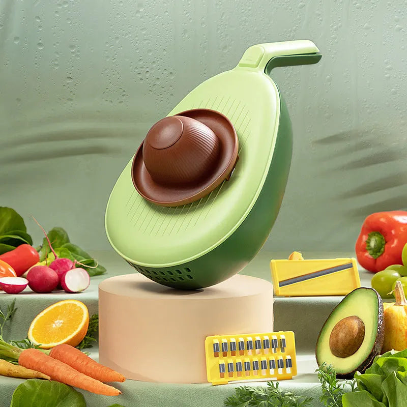 Vegetable grater slicer with six sabres and bottom storage box in avocado green colour on a kitchen counter