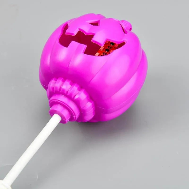 Plastic pumpkin-shaped decorative lamp with USB charging port, showing yellow or purple light option.