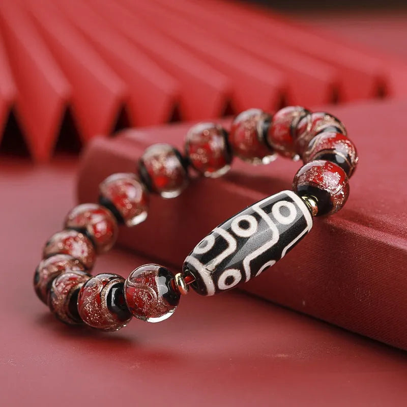 Snake year lucky bracelet with multicoloured glazed beads in Chinese auspicious patterns.