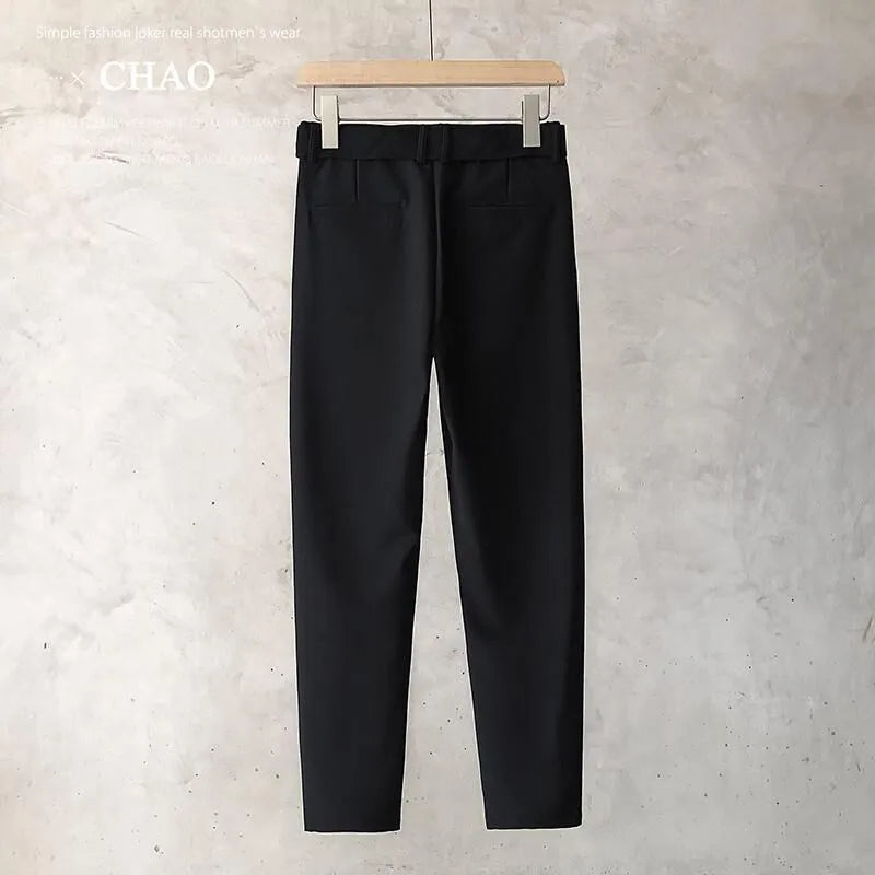 Boys slim straight wool trousers in black showing tapered cut and straight leg opening