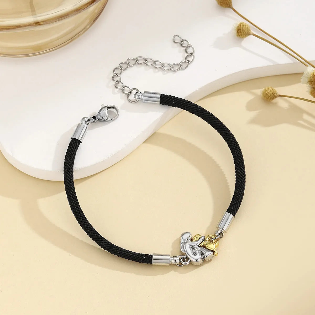 Black electroplated flexible wire woven couple bracelet with angel motif