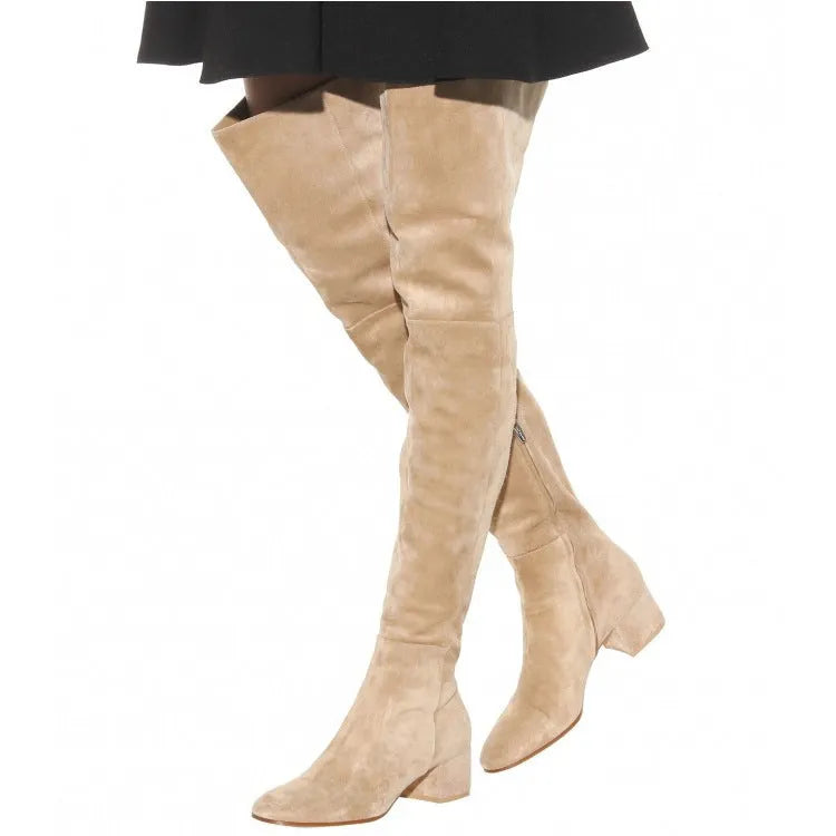 Grey suede women's over-the-knee flat boots with a pointed toe and thick low rubber sole.