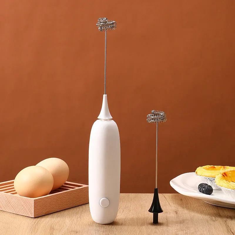 Black and white handheld electric milk frother blender for coffee beverages