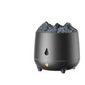 White volcano-shaped ultrasonic humidifier with USB cable on wooden surface