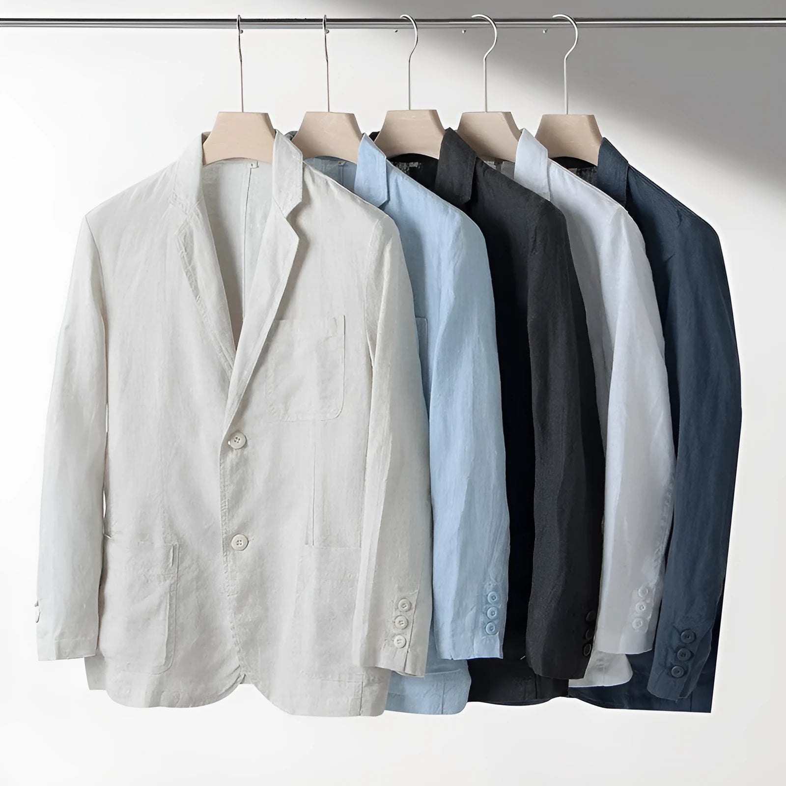 Men's casual linen suit jacket in solid colour with long sleeves and loose fit on a plain background