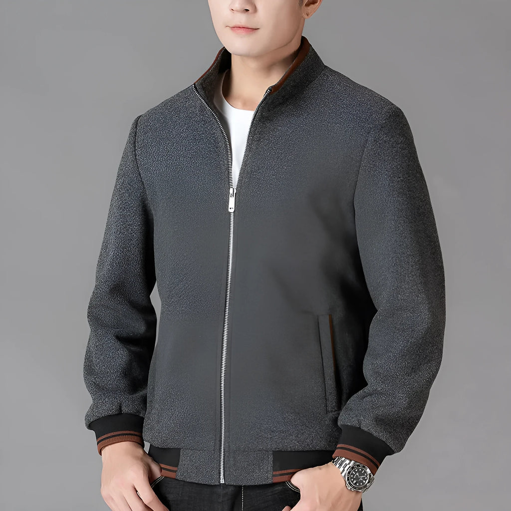 Men's grey polyester fleece sports jacket with long sleeves and a pocket, shown on a hanger.