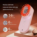 Pink and black smart massage comb with red light therapy for scalp care.
