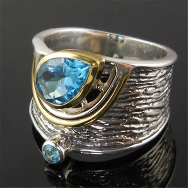 Blue zircon drop shape ring in Creative Chinese Style design, showing inlaid stones on an alloy band.