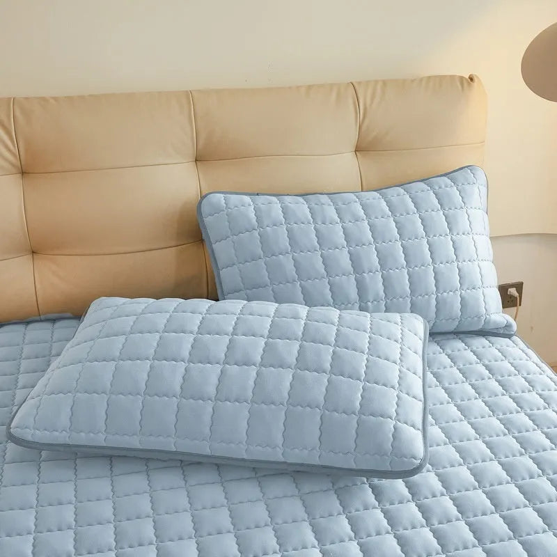 Class A waterproof fitted sheet in blue, shown stretched over a mattress corner.