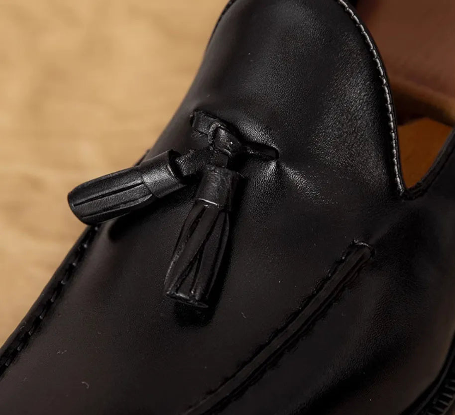 Men's black genuine leather loafers with fringe detailing and slip-on design
