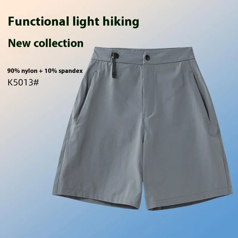 Men's quick-drying sports shorts in khaki colour with elastic waistband.