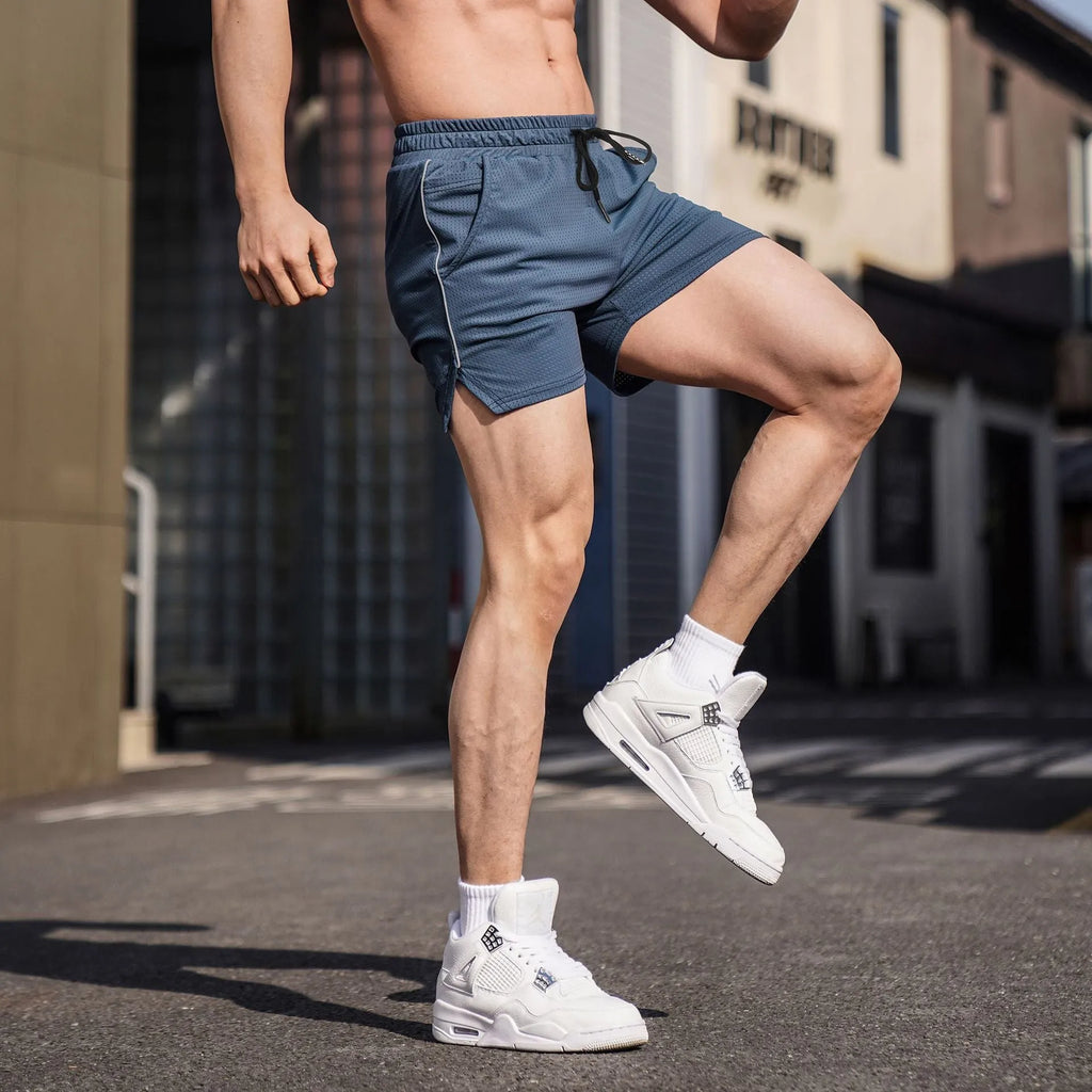 Men's straight cut polyester fitness shorts in black colour showing athletic design