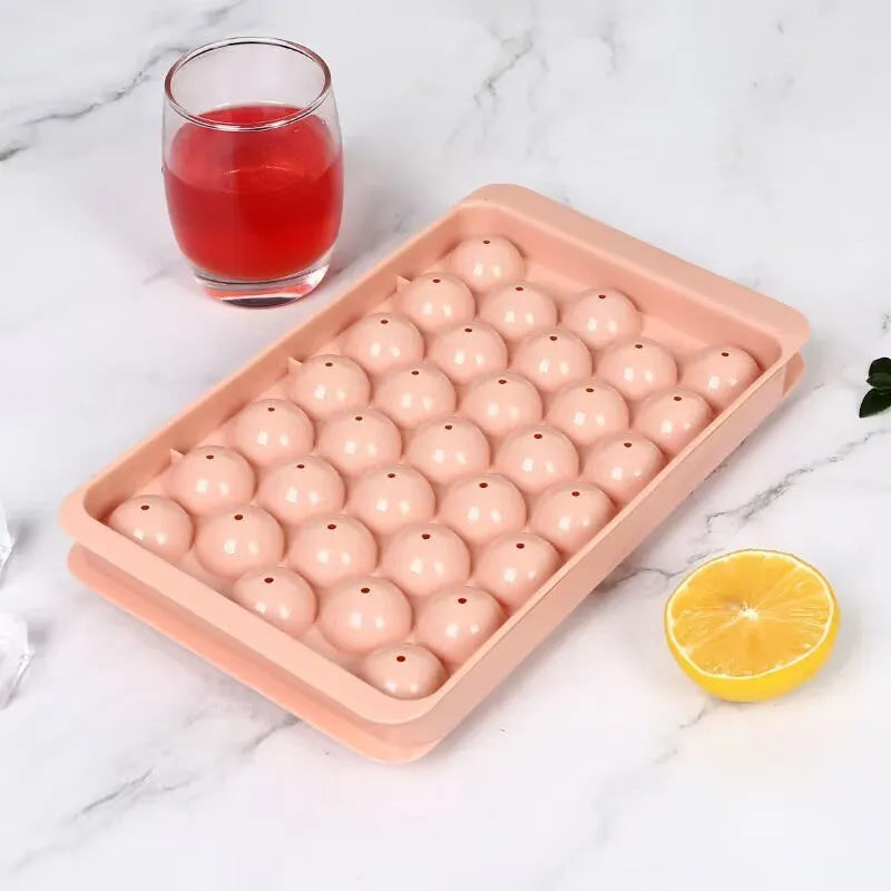 Blue silicone ice cube tray with lid showing 33 round grids for large ice cubes