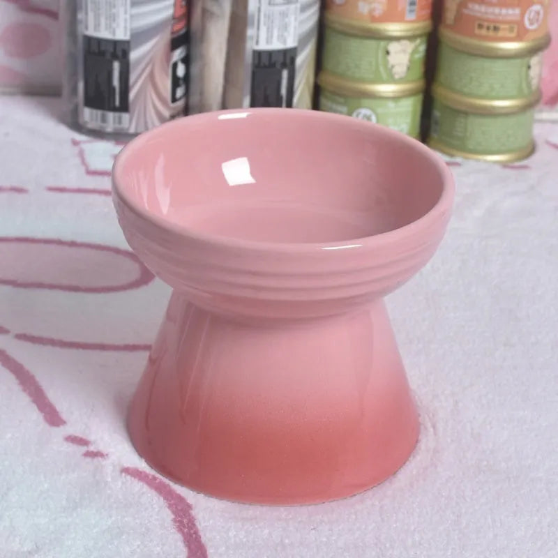 Ceramic anti-tumble pet bowl for dogs and cats with high foot and neck protector.