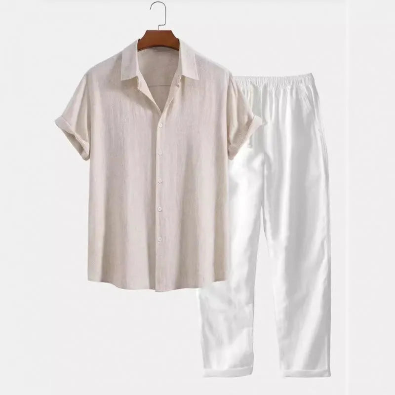 Man wearing a loose-fit light blue linen-blend short sleeve shirt and matching casual trousers.