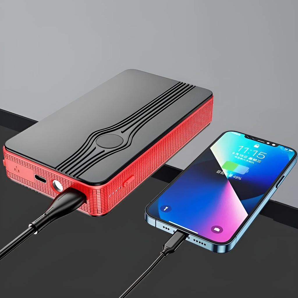 Red K4-E automobile emergency starting power supply unit with display, shown next to its included data cable.