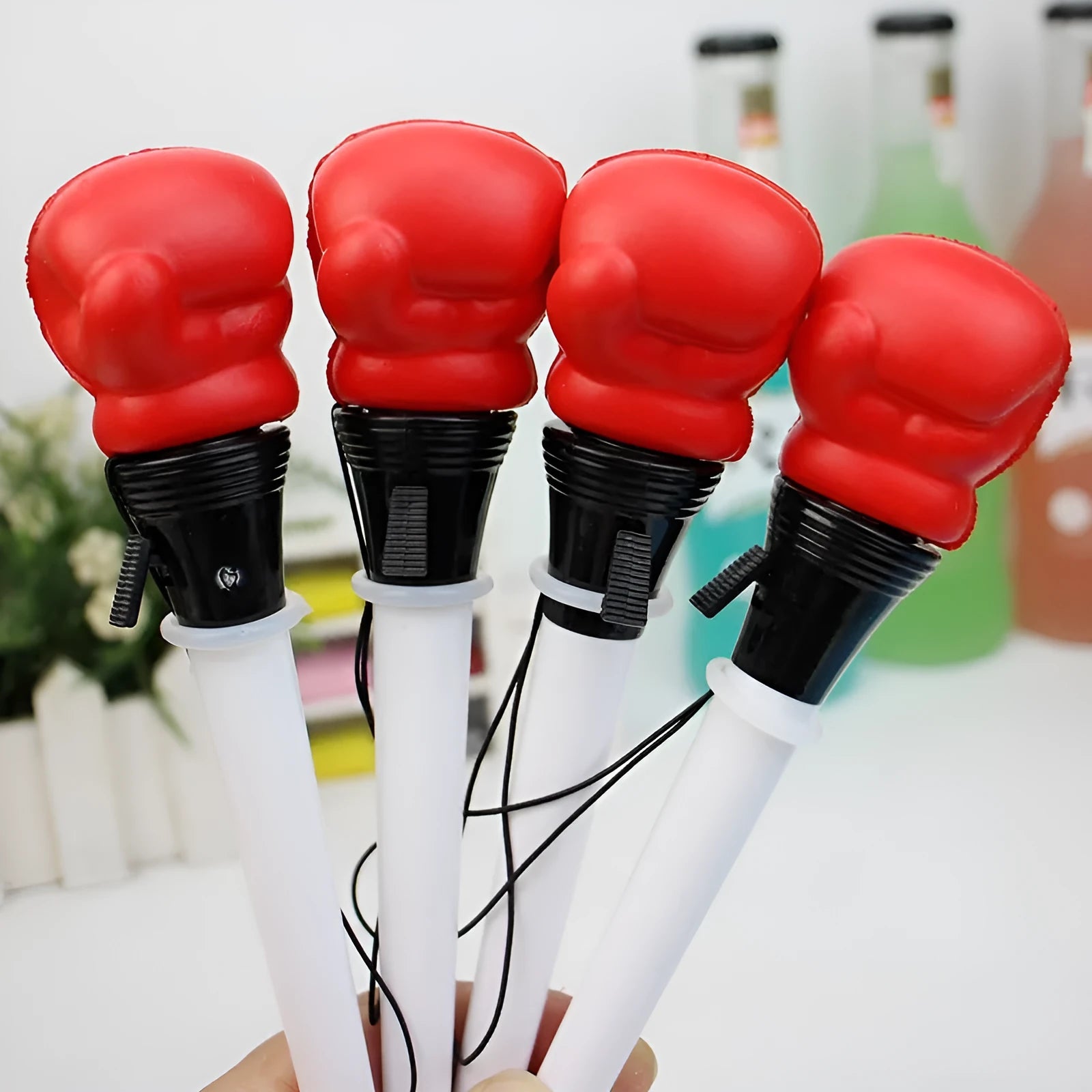 Four black-ink gel pens with pressure-relief ejection mechanisms and 0.7 mm bullet tips