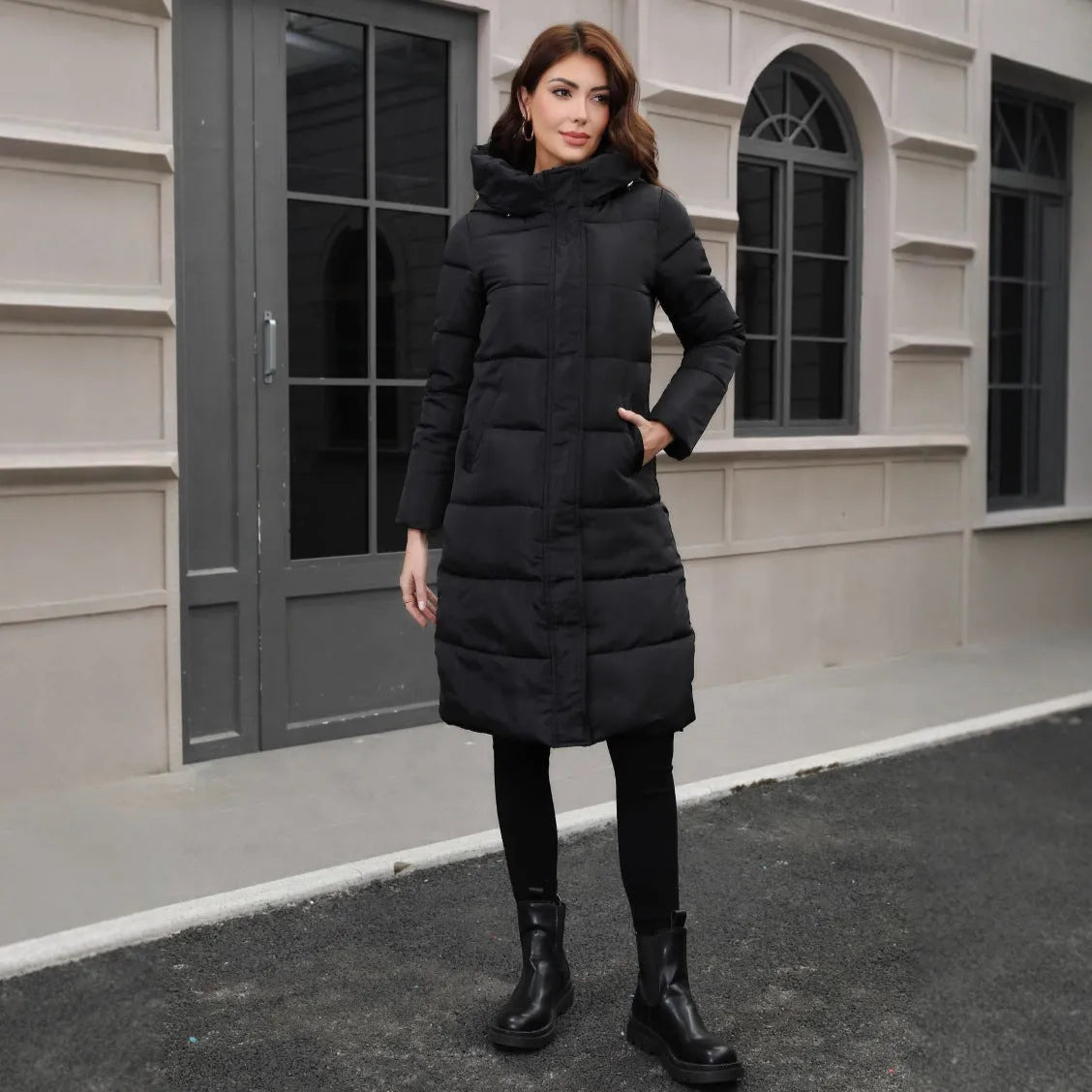 Black slim-fit men's hooded cotton jacket for cold weather, shown on a model.