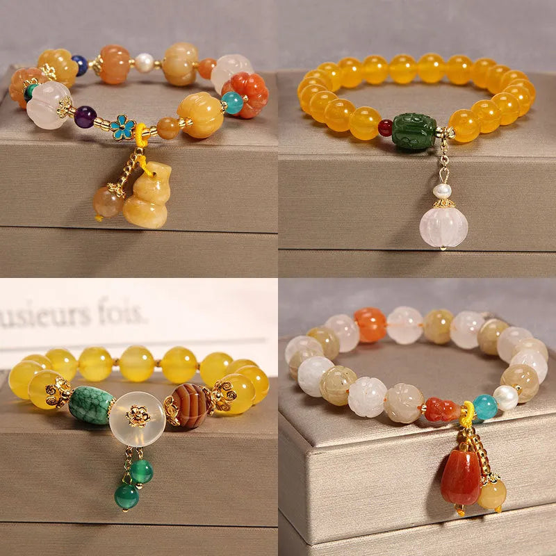 Yellow agate crystal bracelet with gold silk threading on wrist