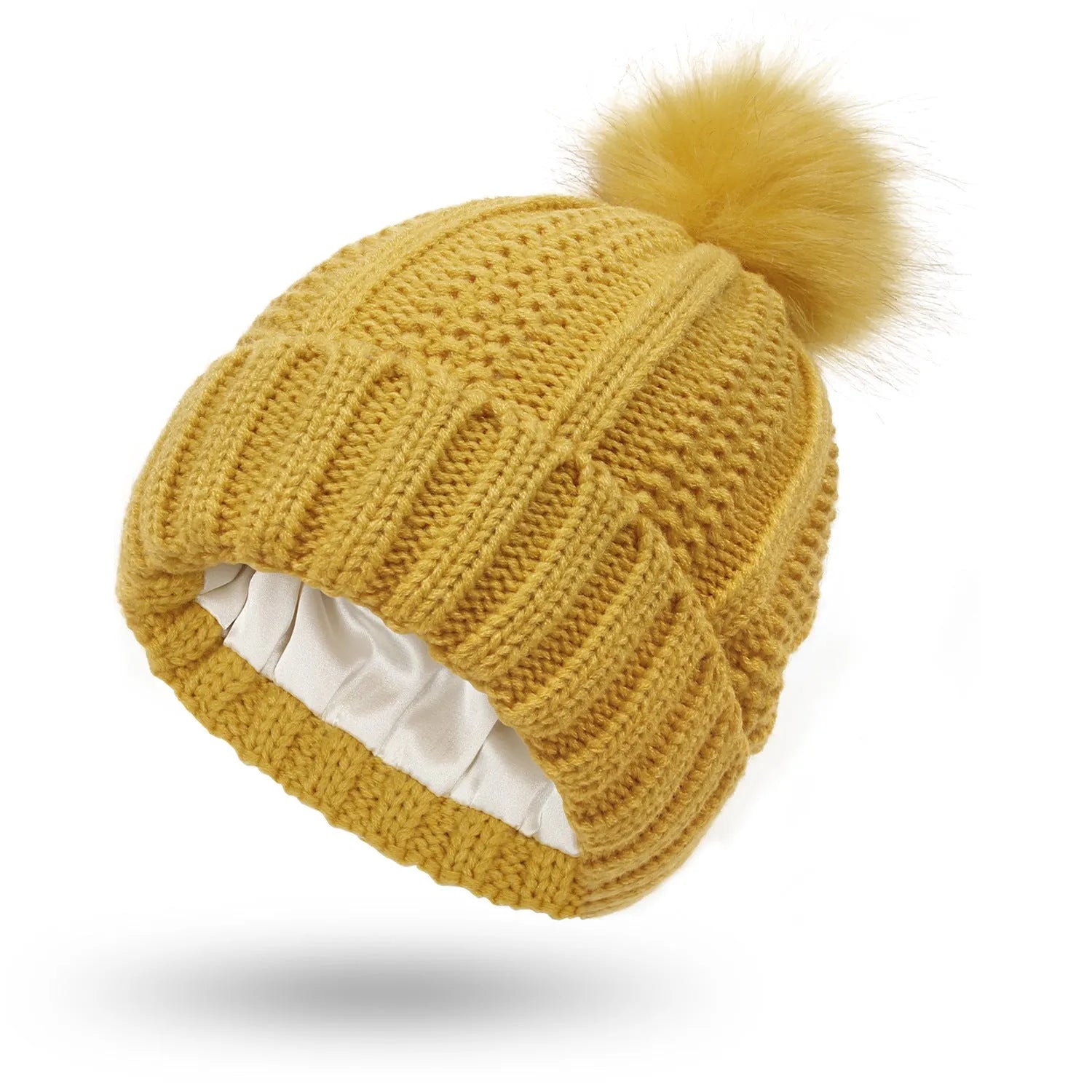Women's wool knit beanie hat with faux fur pom pom and satin lining in eight colour options.