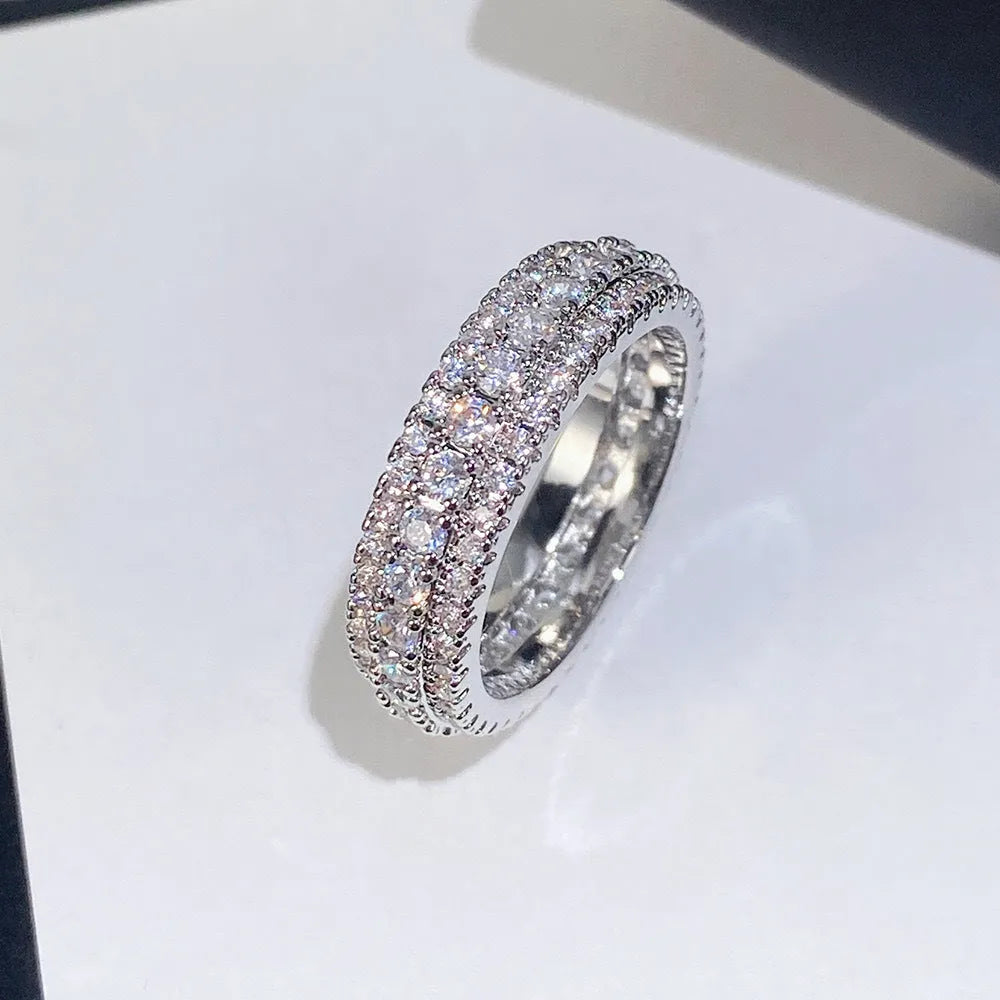 Personalised geometric triangle engagement ring with zircon stone in a choice of finishes.