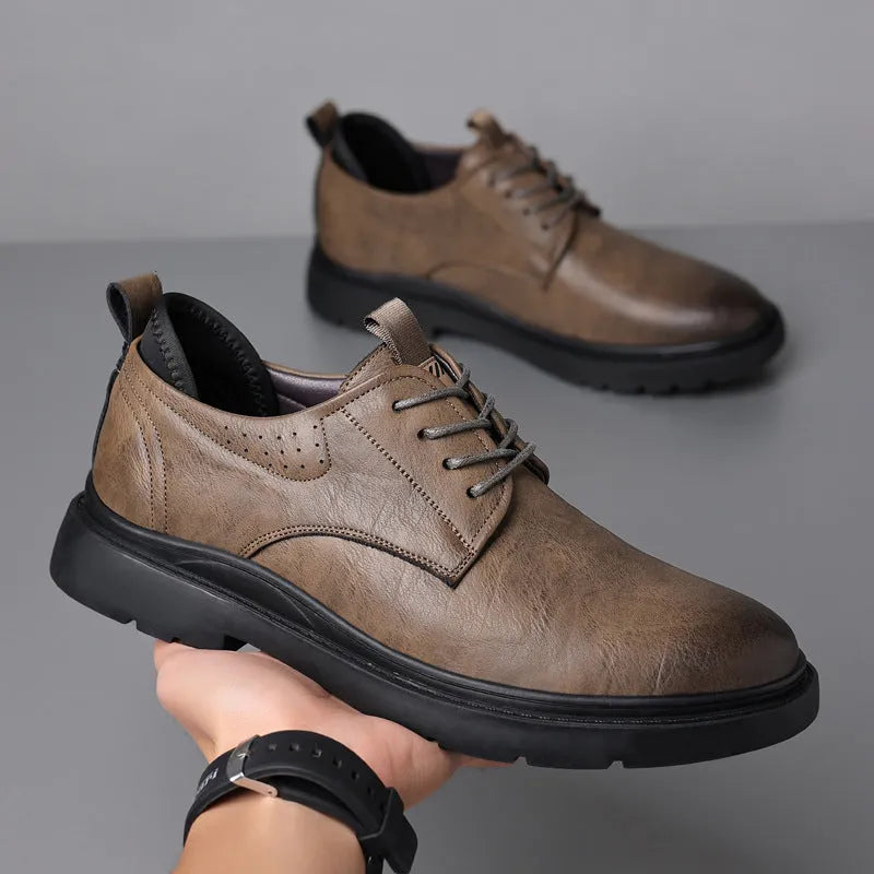 Men's black and brown leather casual sneakers with rubber sole and sewing line detailing