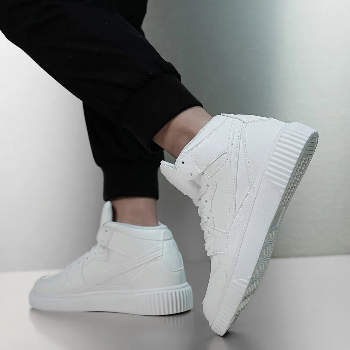 Men's solid white round toe casual shoes with a microfiber leather upper on a neutral background.
