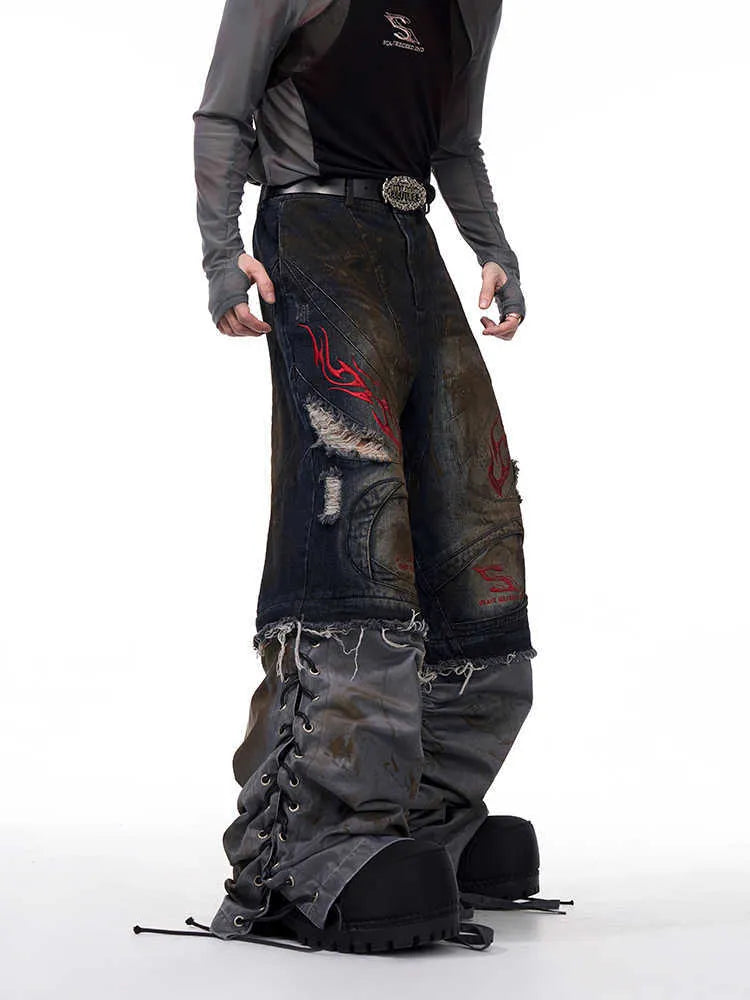 Men's light blue retro jeans with detachable legs showing wide loose fit and mid-high waist
