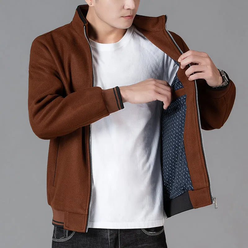 Men's grey polyester fleece sports jacket with long sleeves and a pocket, shown on a hanger.