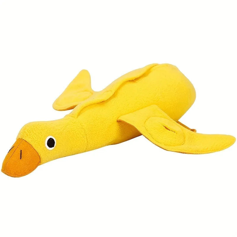Yellow plush duck dog toy with squeaker and treat dispensing holes for training and chewing.