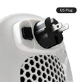 White ceramic electric air heater with remote control on a table.