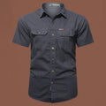 Men's short sleeve cotton work shirt in a loose cardigan style, shown in one of eight available colours.