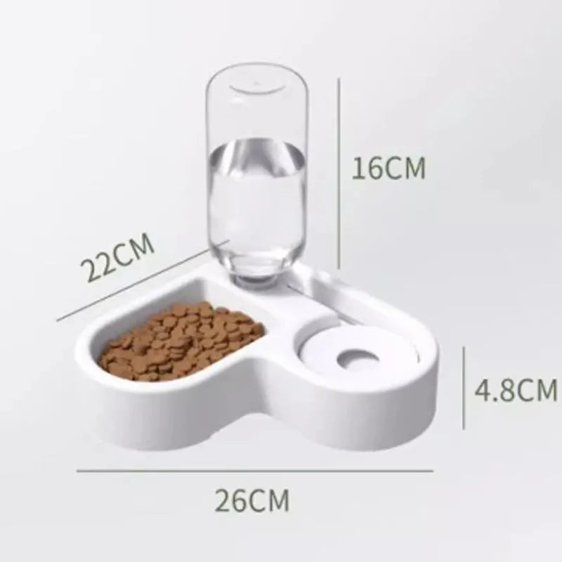 White pet water fountain for cats and dogs indoors on a kitchen floor.