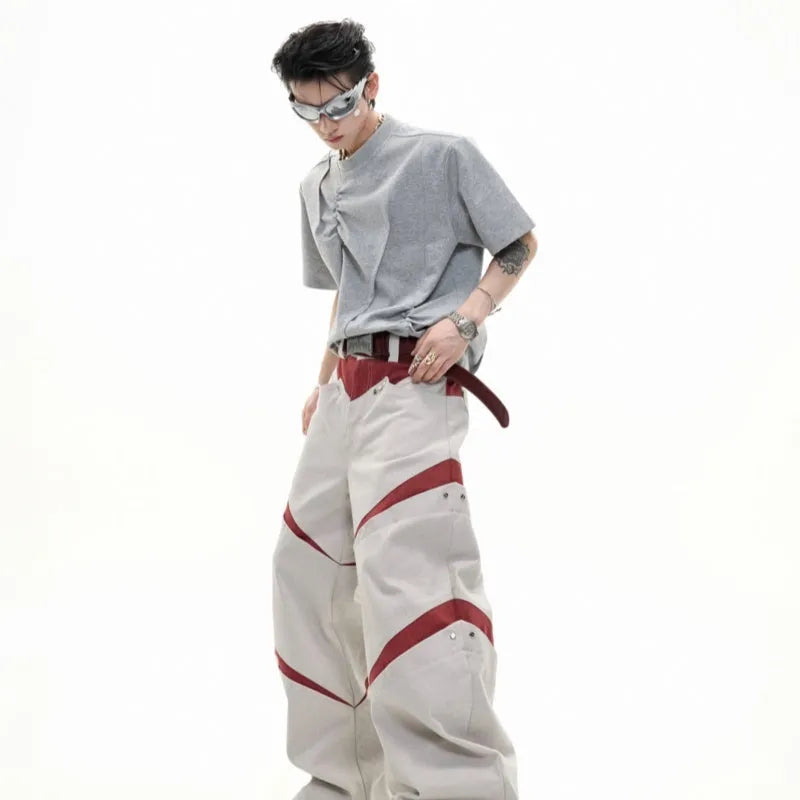 Men's loose fit grey cotton T-shirt with pleated detail and asymmetric stitching on a short sleeve.