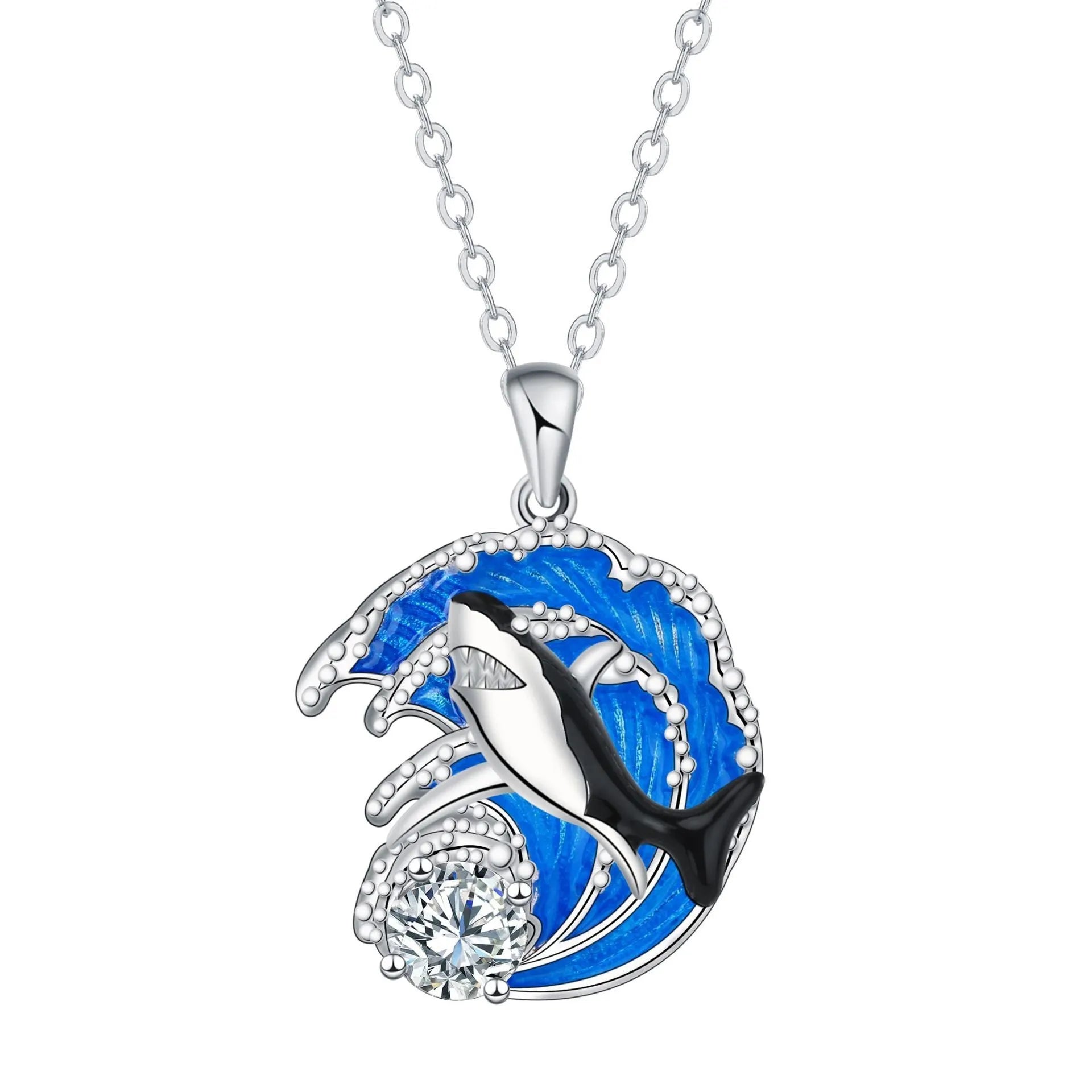 Women's silver-tone necklace with a detailed shark pendant on a cross chain.