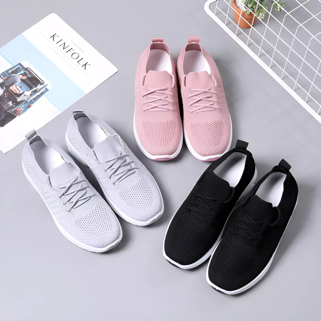 Women's black mesh lace-up sneakers with a round toe and soft PVC sole on a white background.