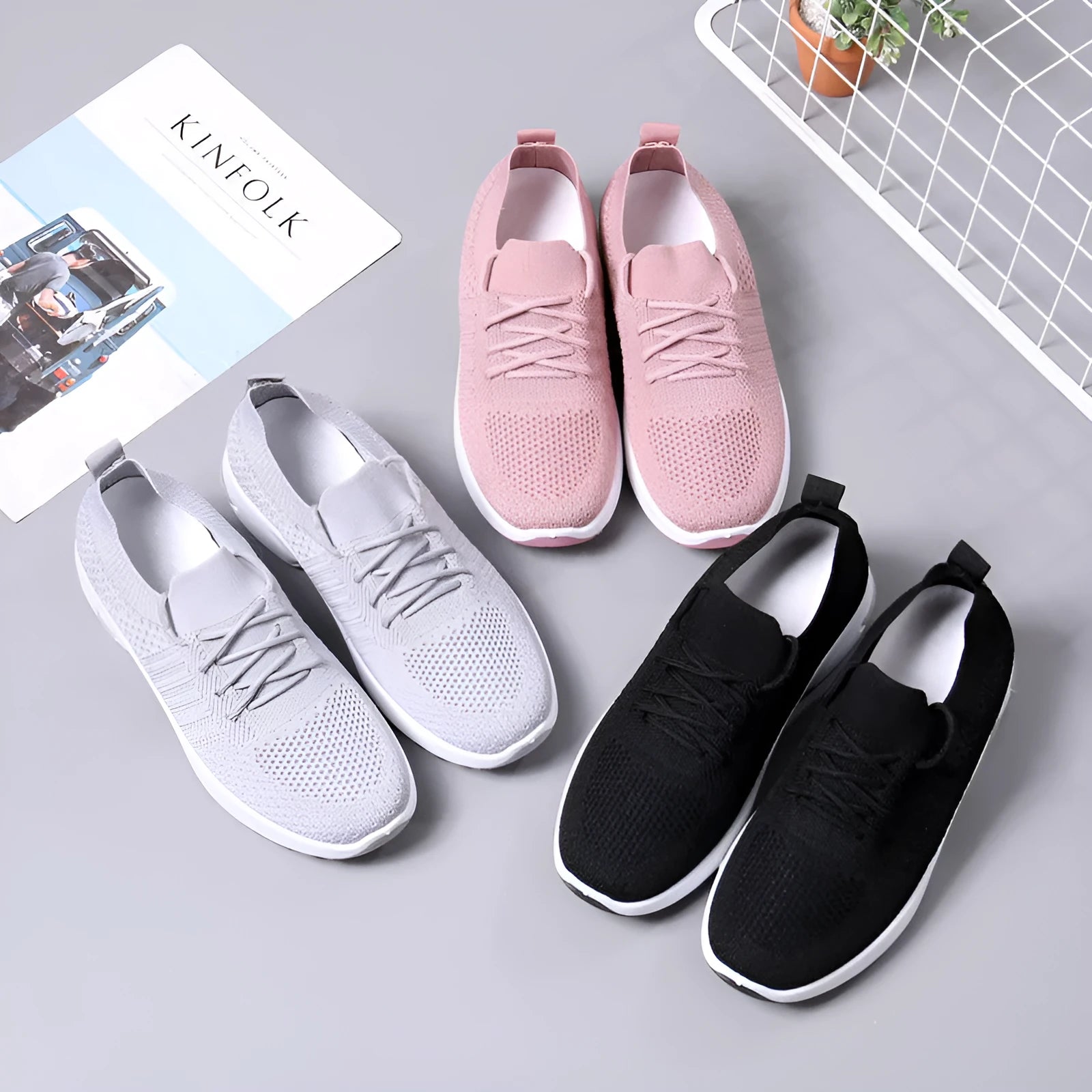 Women's black mesh lace-up sneakers with a round toe and soft PVC sole on a white background.
