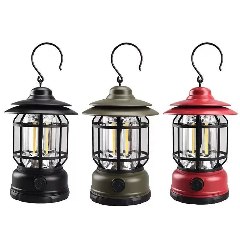 Portable camping lantern with handle in black, dark green, or red colour options.