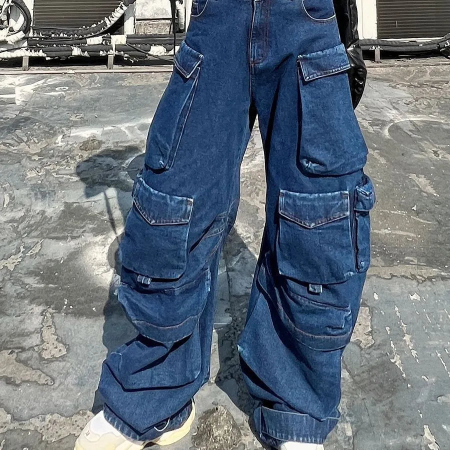 Women's dark blue distressed wide-leg high waist jeans with multiple pockets on a mannequin.
