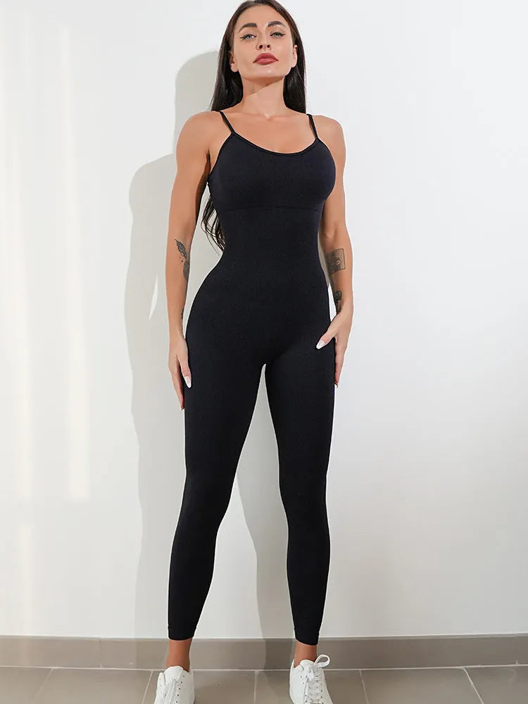 Women's black unitard jumpsuit with spaghetti straps and tummy control design