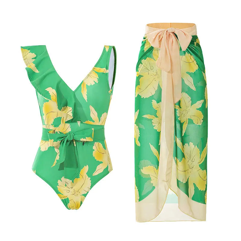 Women's solid colour one-piece swimsuit with spaghetti straps and a detachable skirt.