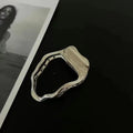 Gold and silver zinc alloy hair barrettes in square, arc, and triangle shapes.