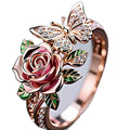 Adjustable fairy style ring with colourful oil-drip butterfly pendant and floral elements