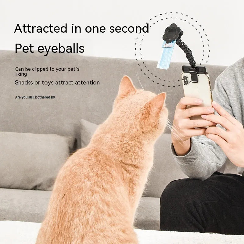 Pet photography selfie stick with clip for snacks in black plastic, showing phone holder and rotatable head