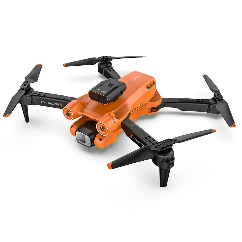 Black foldable quadcopter drone with four propellers and a mounted camera, shown next to its remote control.