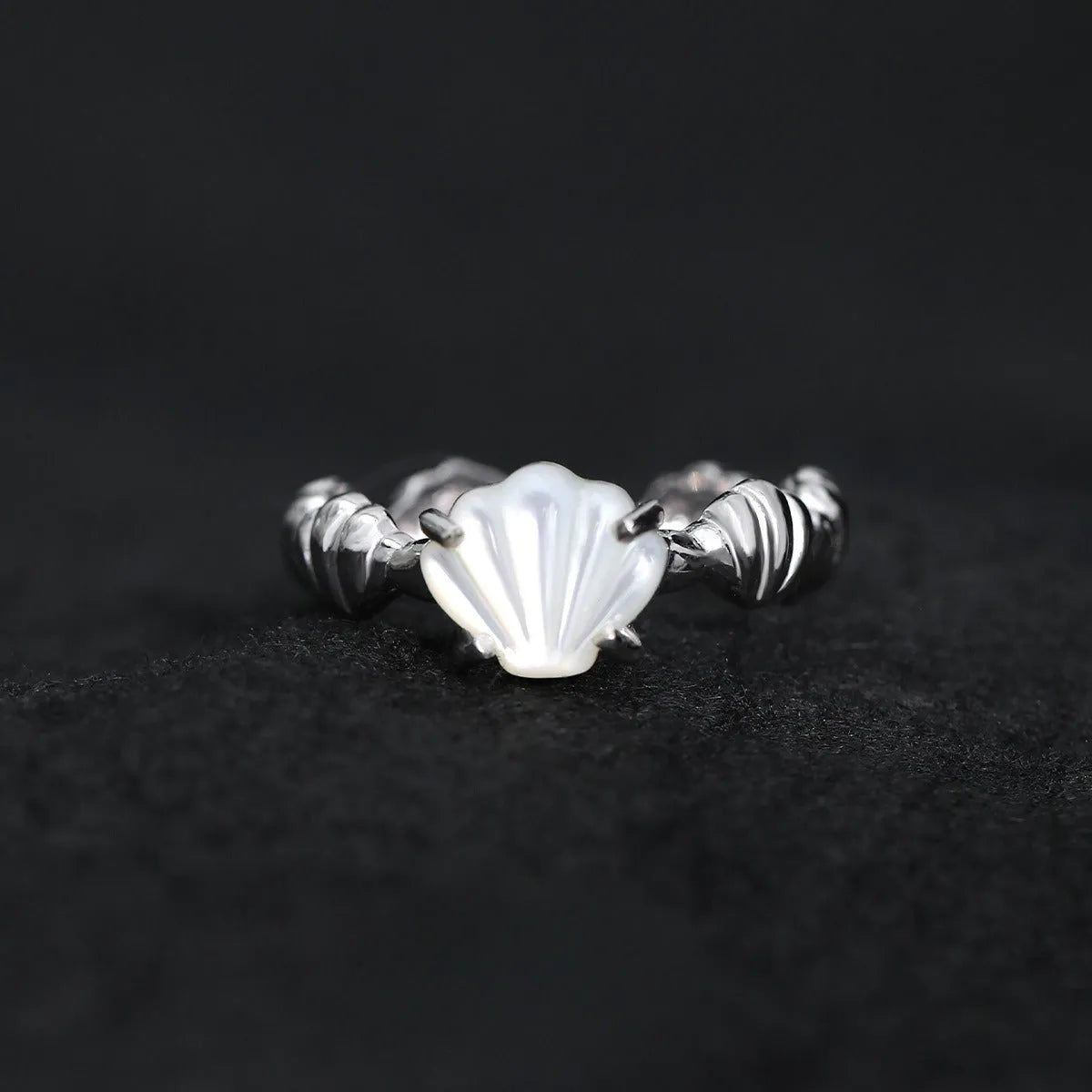 Women's adjustable silver ring with a shell design and set tiger eye gemstone in a gold colour finish.
