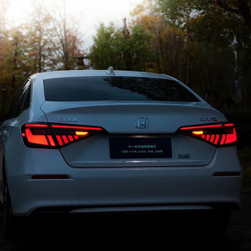 11th Generation Honda Civic black and red LED taillight assembly with streamer indicators.