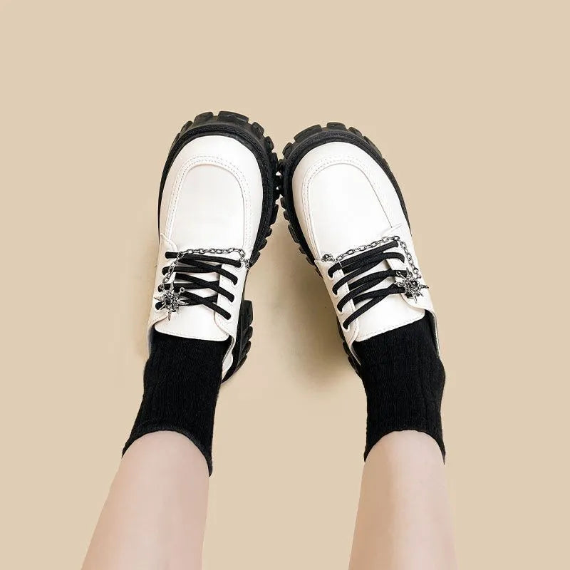 Women's preppy style loafers in Duke Asterism colour with cross shoulder strap and round toe
