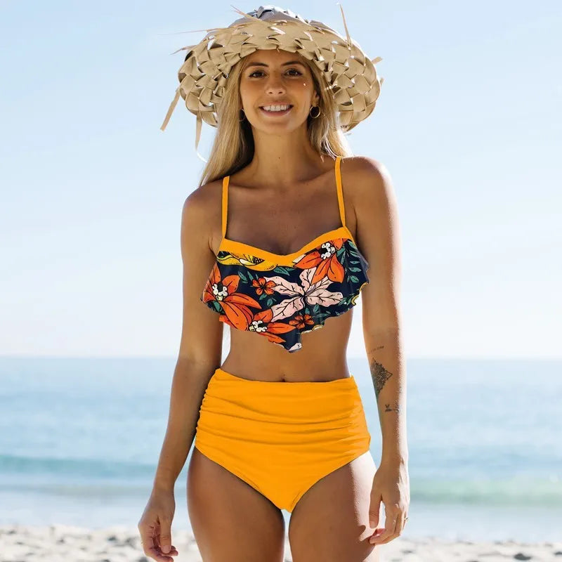 Blue high waisted women's swimsuit with pleated floral pants and separate bikini top