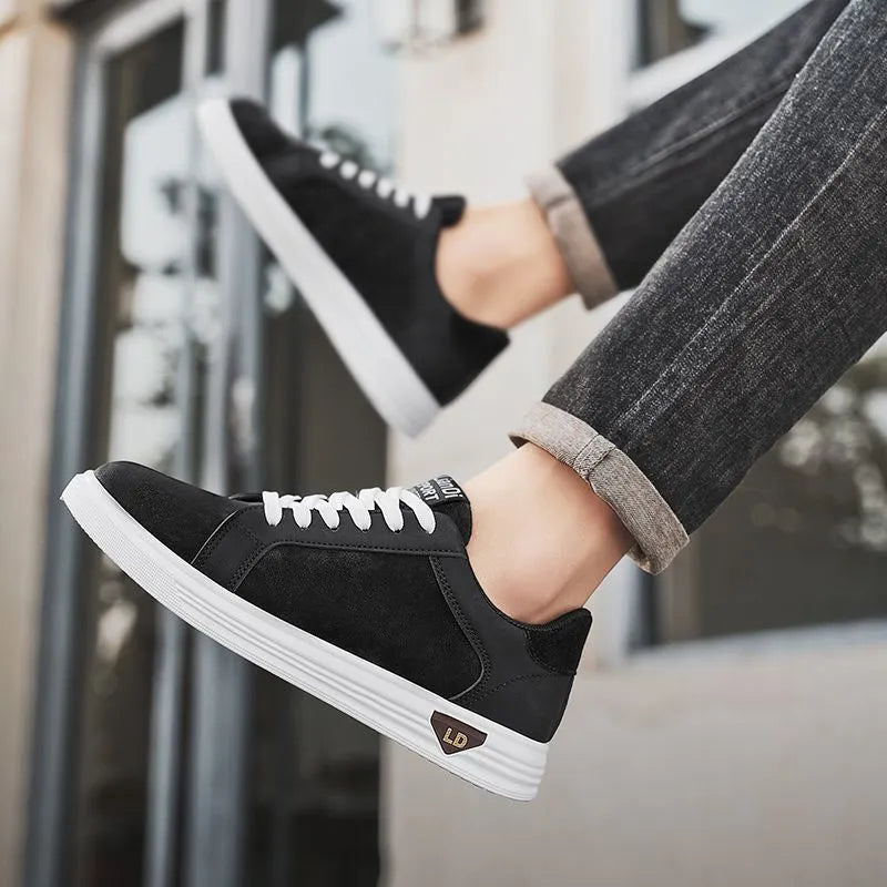 Men's low-top casual sneakers with snake pattern in black, PU upper, round toe, on a neutral background.